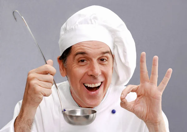 Expressive Cook Holding Spoon Tasting Food — Stock Photo, Image