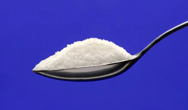 White Sugar Teaspoon Blue Background — Stock Photo, Image