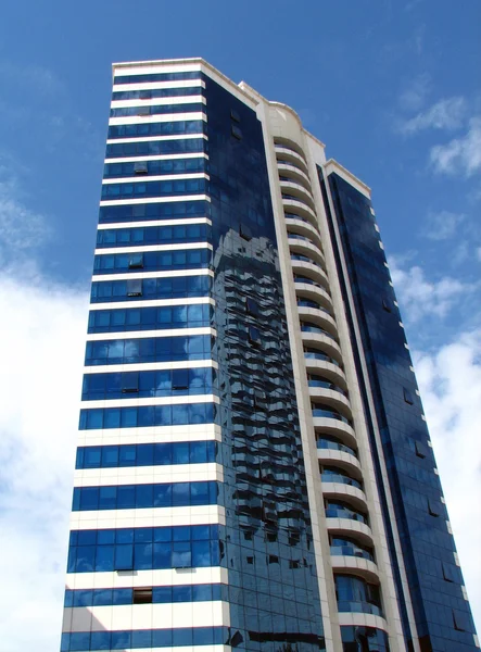 Modern tower building with reflection — Stock Photo, Image