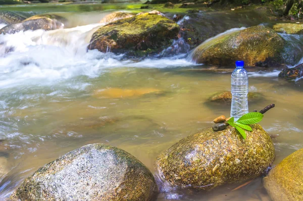 Bottle and water stream — Stock Photo, Image