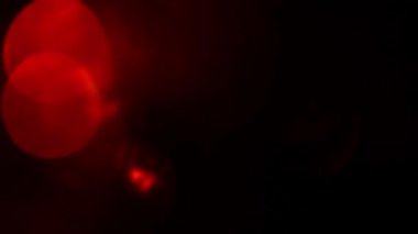 hareketli kırmızı ışıklar defocused. koyu arka plan döngü.