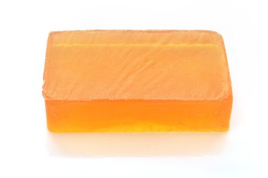 Orange handmade glycerin soap on white. clipart