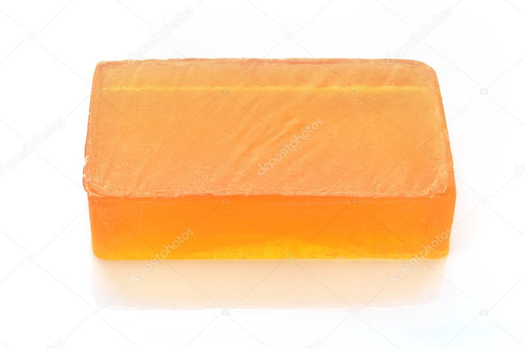 Orange handmade glycerin soap on white.
