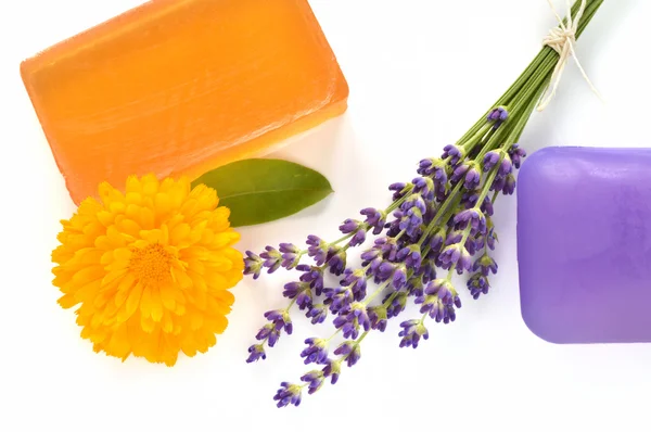 Handmade glycerin soaps with flowers. — Stock Photo, Image