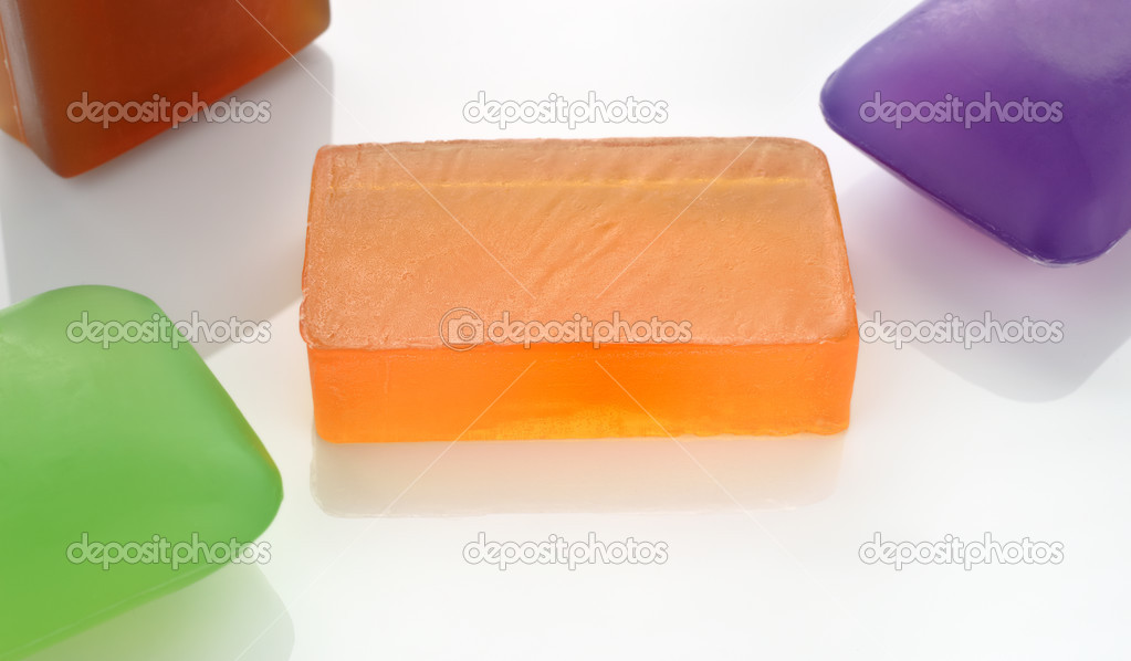 Few colorful glycerin soaps on white.