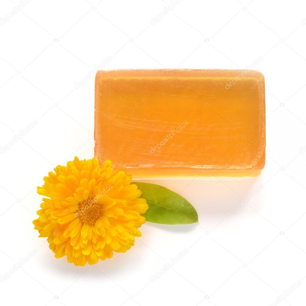 Orange handmade glycerin soap on white.
