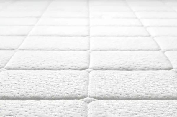 Detail textury bílé matrace. — Stock fotografie