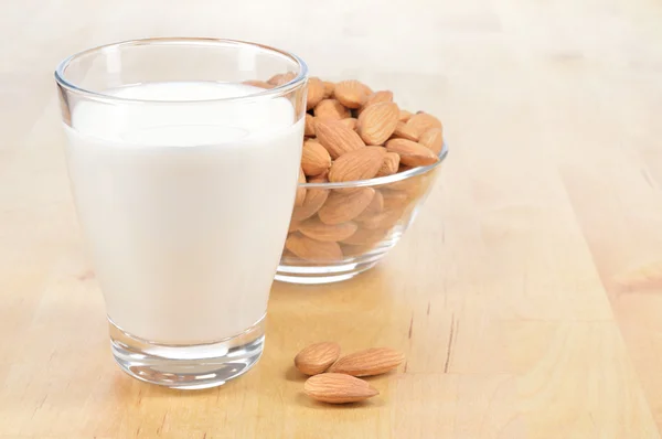 Glass of Almond milk on a table. — Stock Photo, Image
