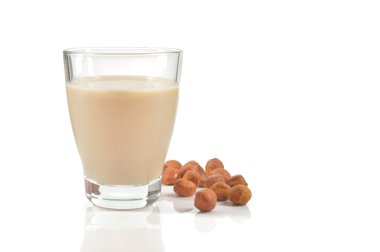 Glass of hazelnut milk or drink on white. clipart