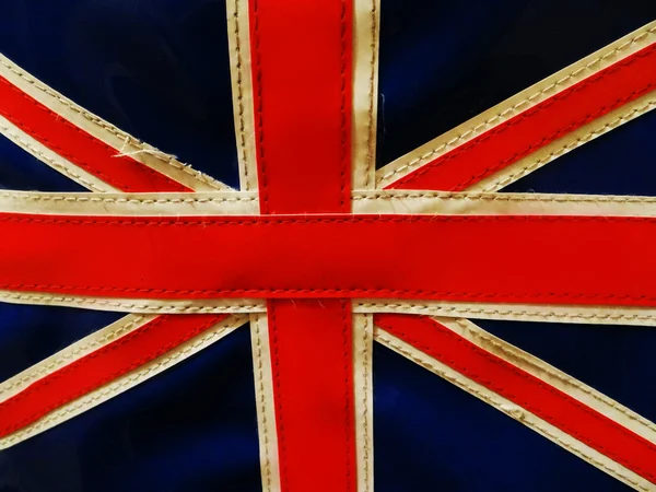 Bright tattered badge of Union Jack — Stock Photo, Image