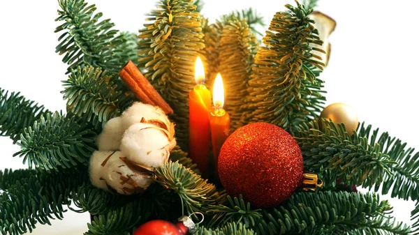 Christmas decoration with candles. Composition of Christmas tree branches — Fotografia de Stock