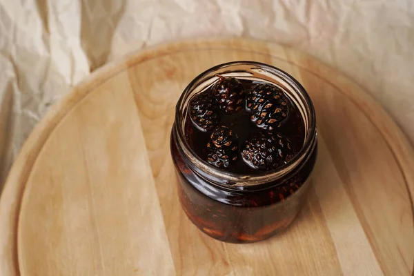 Eco friendly, healthy pine cone jam in a jar on a wooden board — Stock Photo, Image