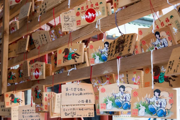 TOKYO, JAPAN - APRIL 4 2014: Ema praying tablets at Kanda Myojin Shrine. Ema are small wooden plaques used for wishes by shinto believers. — Stock Photo, Image