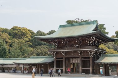 TOKYO, JAPAN - APRIL 10 2014: Meiji Shrine(Meiji Jingu). Meiji Shrine is the Shinto shrine dedicated to the divine souls of Emperor Meiji and his wife, Empress Shoken. clipart