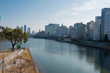 Osaka, Japan - Jan 03 2022- Okawa River (Kyu-Yodo River) view from Tenjin Bridge (Tenjinbashi) in Nakanoshima, Kita-ku, Osaka, Japan.