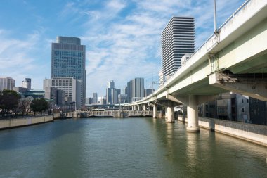 Osaka, Japan - Jan 03 2022- Dojima River (Kyu-Yodo River) view from Suisho Bridge (Suishobashi) in Kita-ku, Osaka, Japan.