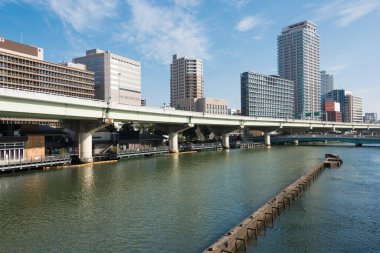 Osaka, Japan - Jan 03 2022- Dojima River (Kyu-Yodo River) view from Suisho Bridge (Suishobashi) in Kita-ku, Osaka, Japan.