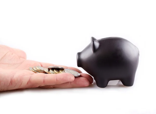 Black piggy bank with money — Stock Photo, Image