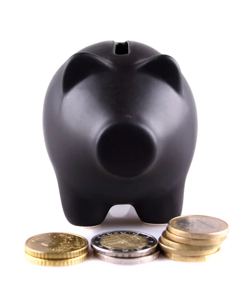 Black piggy bank with euro coins — Stock Photo, Image