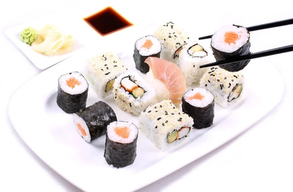 Eat sushi with chopsticks — Stock Photo, Image