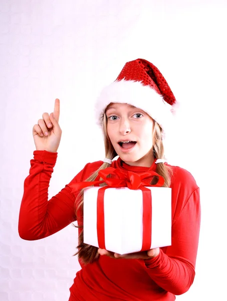 Mrs. Santa holding a gift and calling — Stock Photo, Image