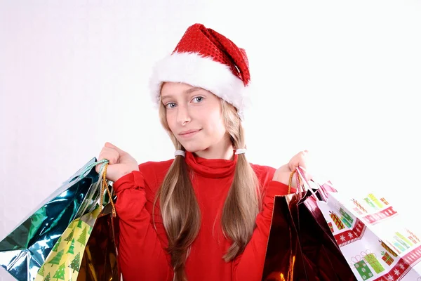 Mrs. santa in rood met shopping tassen — Stockfoto