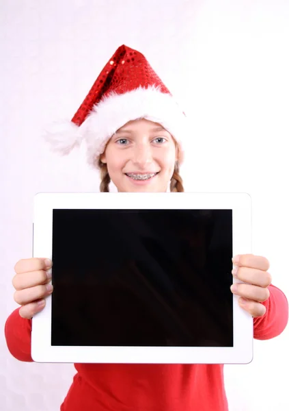Laughing Girl as Mrs. Santa with tablet — Stock Photo, Image