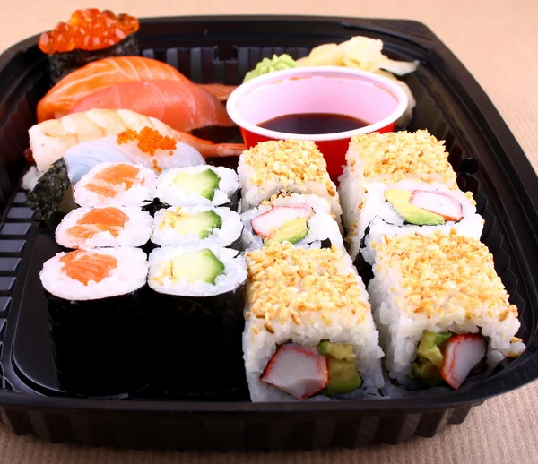 Exclusive sushi menu in black Delivery Box — Stock Photo, Image