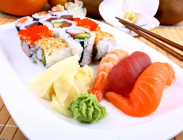 Appetizing sushi with wasabi and chopsticks — Stock Photo, Image
