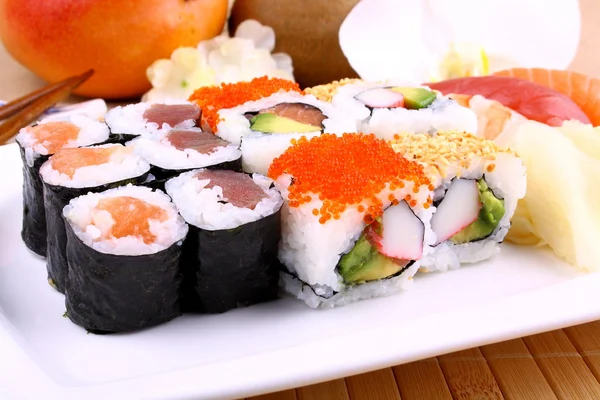 Assorted sushi, wasabi and chopsticks — Stock Photo, Image