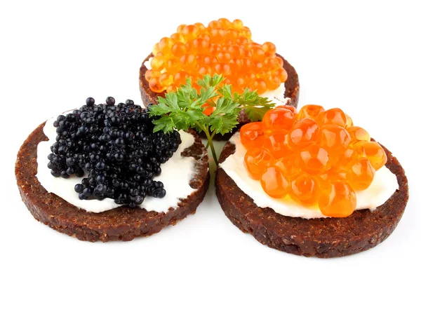 Pumpernickel bread with red and black caviar — Stock Photo, Image