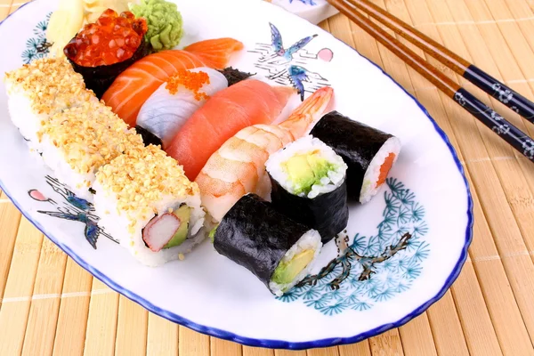 Sushi with chopsticks and red caviar — Stock Photo, Image