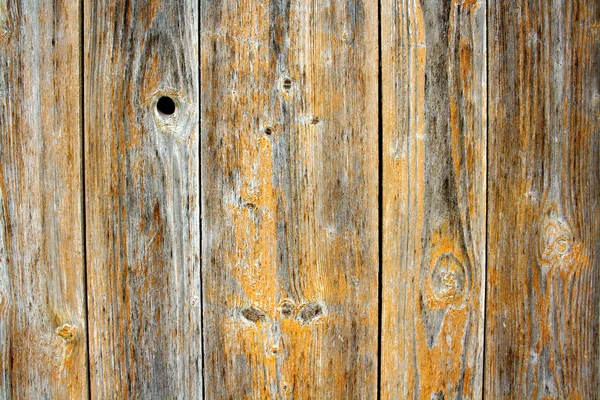 Tablero de madera viejo con agujeros como fondo — Foto de Stock