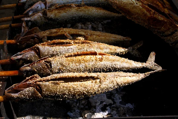 Grilled fish (Steckerlfisch) at Munich Oktoberfest — Stock Image Grilled fish (Steckerlfisch) at Munich Oktoberfest Stock Photo