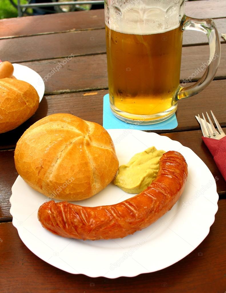 Grilled sausage with bread, mustard and beer