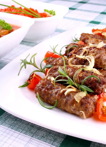 Grilled meat rolls with giant white beans and sauce — Stock Photo, Image