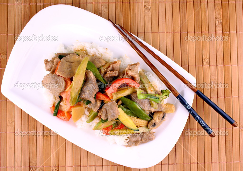 Beef with mushrooms, baby corn, carrots in peanut sauce