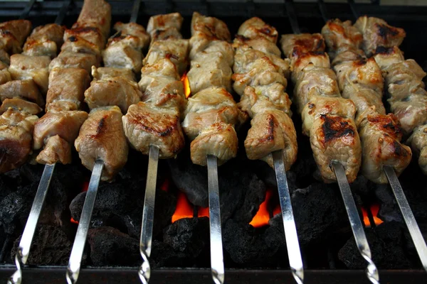 Marinated lamb meat grilling on metal skewer — Stock Photo, Image