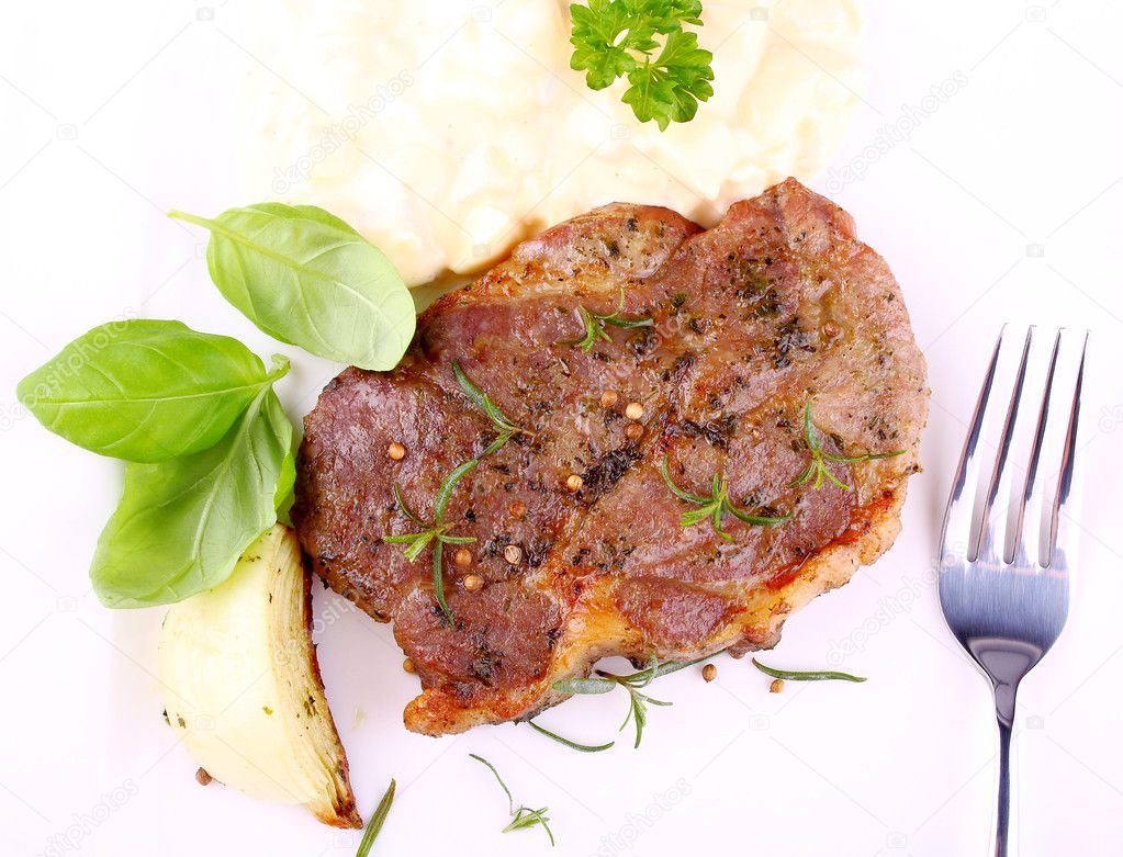 Herb Grilled steak meat with onion, basil and potato salad