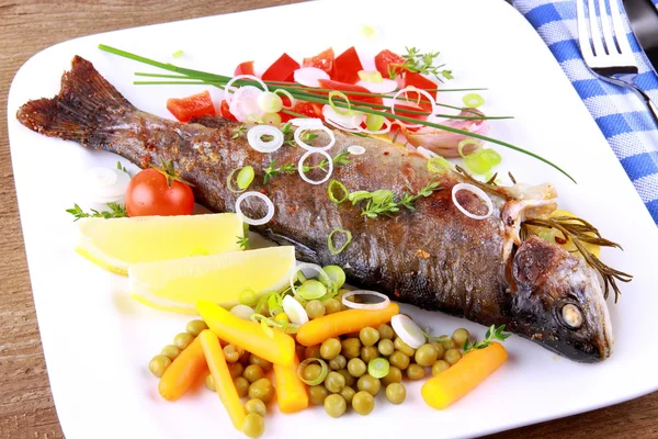 Grilled trout with quite different vegetables with cutlery — Stock Photo, Image