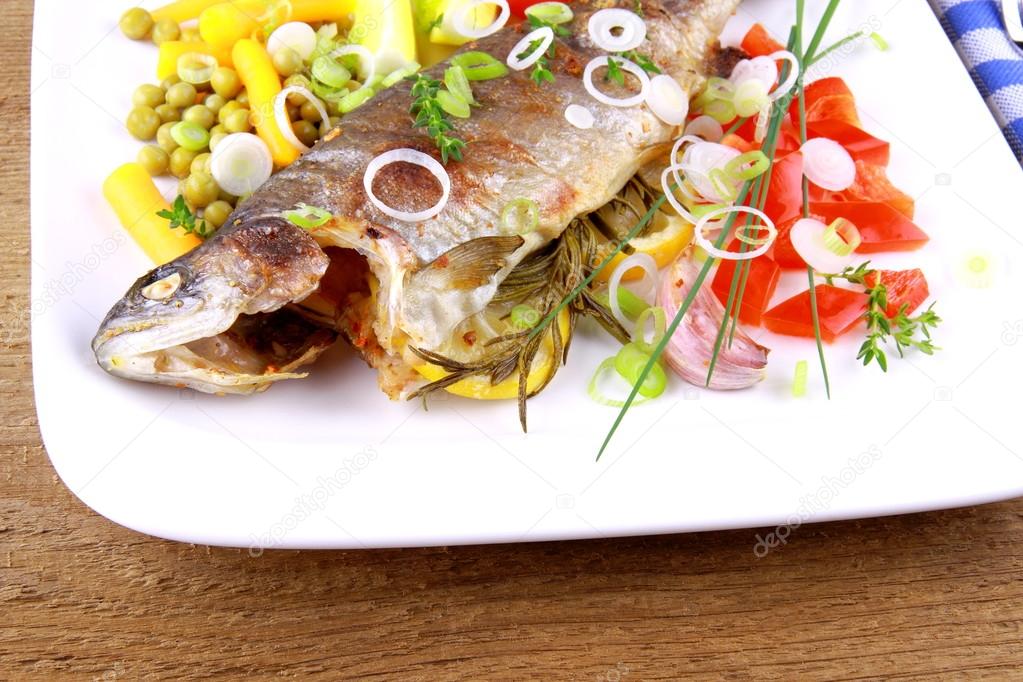 Grilled trout with quite fine vegetables and cutlery