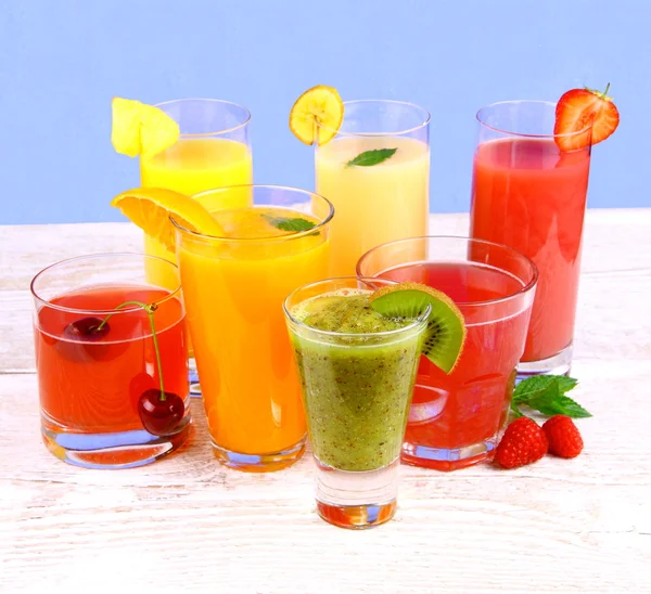 Fruit juices, kiwi, raspberries, cherry, orange, strawberry, pineapple — Stock Photo, Image