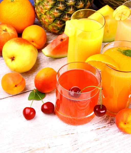 Fruits juice with cherry, apricot and orange — Stock Photo, Image