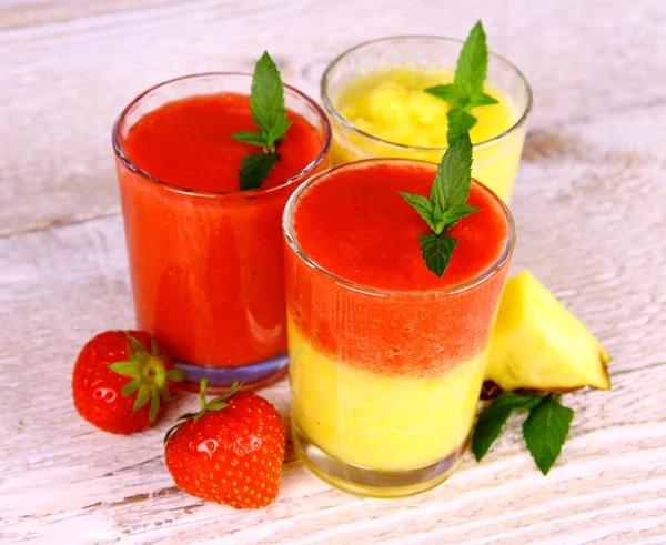 Strawberry and pineapple smoothie in glass mixed — Stock Photo, Image