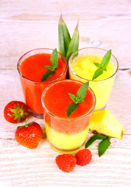 Raspberry, strawberry and pineapple smoothie mixed, deco — Stock Photo, Image