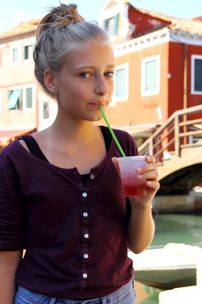 Cute girl with red slush drink — Stock Photo, Image