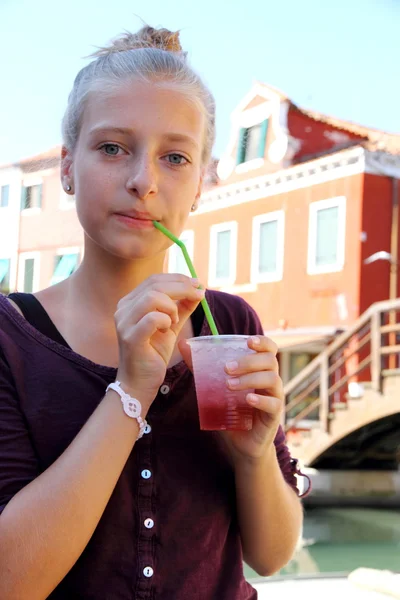 Cute girl with red slush drink — Stock Photo, Image