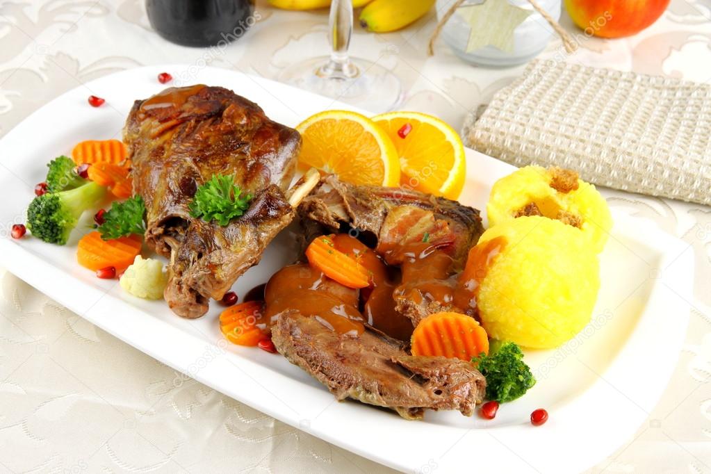 Braised rabbit meat with potato dumplings and vegetables