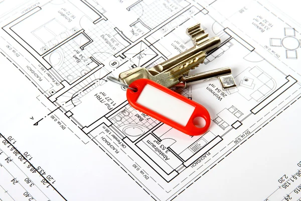 Bunch of keys with red keychains at building drawing Stock Photo