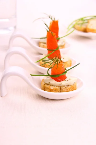 Smoked Lachsrollchen on white bread chunks — Stock Photo, Image